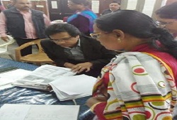 State Coordinator NRC checks the Office Verification documents at the Office Verification Cell in Nagaon today (7th Dec, 2015).