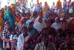 Public gathers for a public awareness meeting held on NRC Updation process