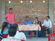 Government officials addressing the public during an awareness meeting in Golaghat District