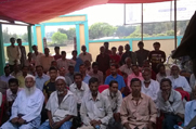 Public attends an awareness meeting organised at Neelam Bazar in Karimganj District
