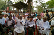 Public seen going through the NRC leaflets distributed during an awareness meeting held at Habi Baranga Bari in Morigaon District