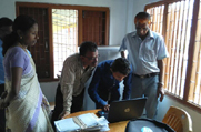 An operator seen assisting the gathering in looking up for records at the Legacy Data at an NSK in Golaghat District